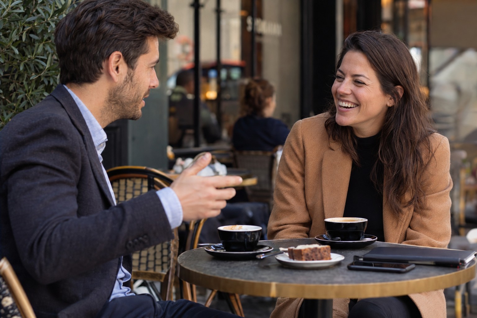 Photorealistic image of two colleagues at a cafe, generated by GPT Image 2.5 Sunburst at max quality