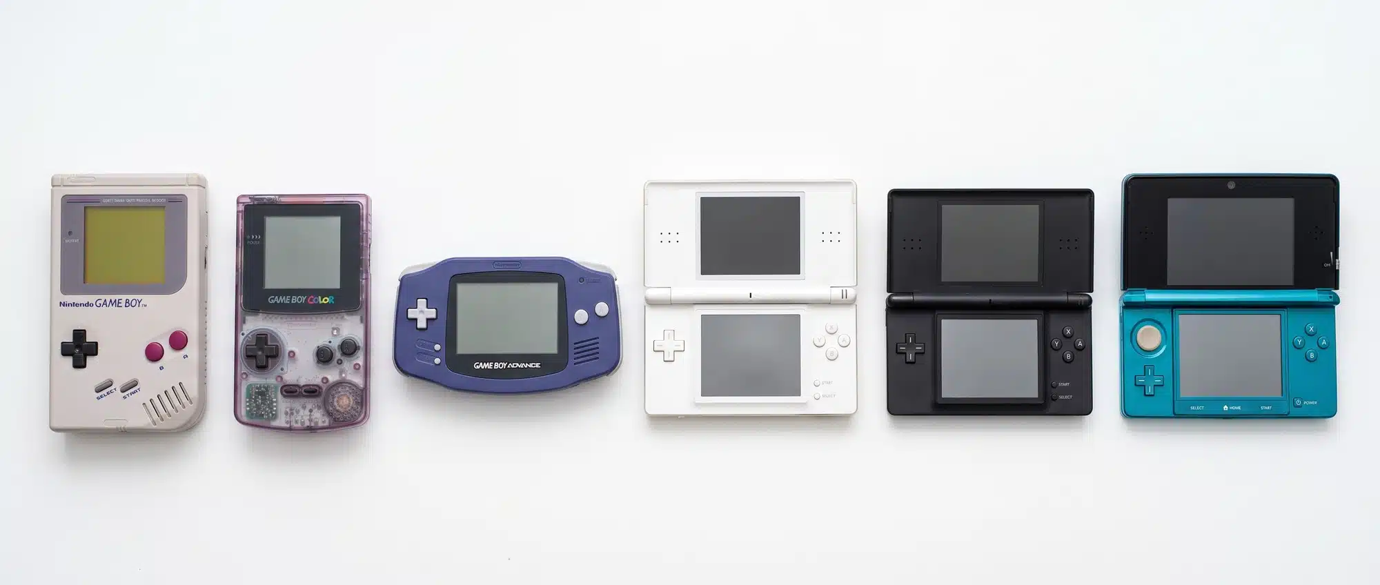 Collection of Nintendo handheld consoles from Game Boy to Nintendo 3DS arranged in order