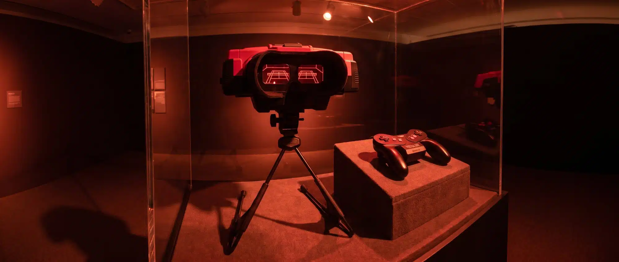 Nintendo Virtual Boy tabletop console with red 3D goggles on stand