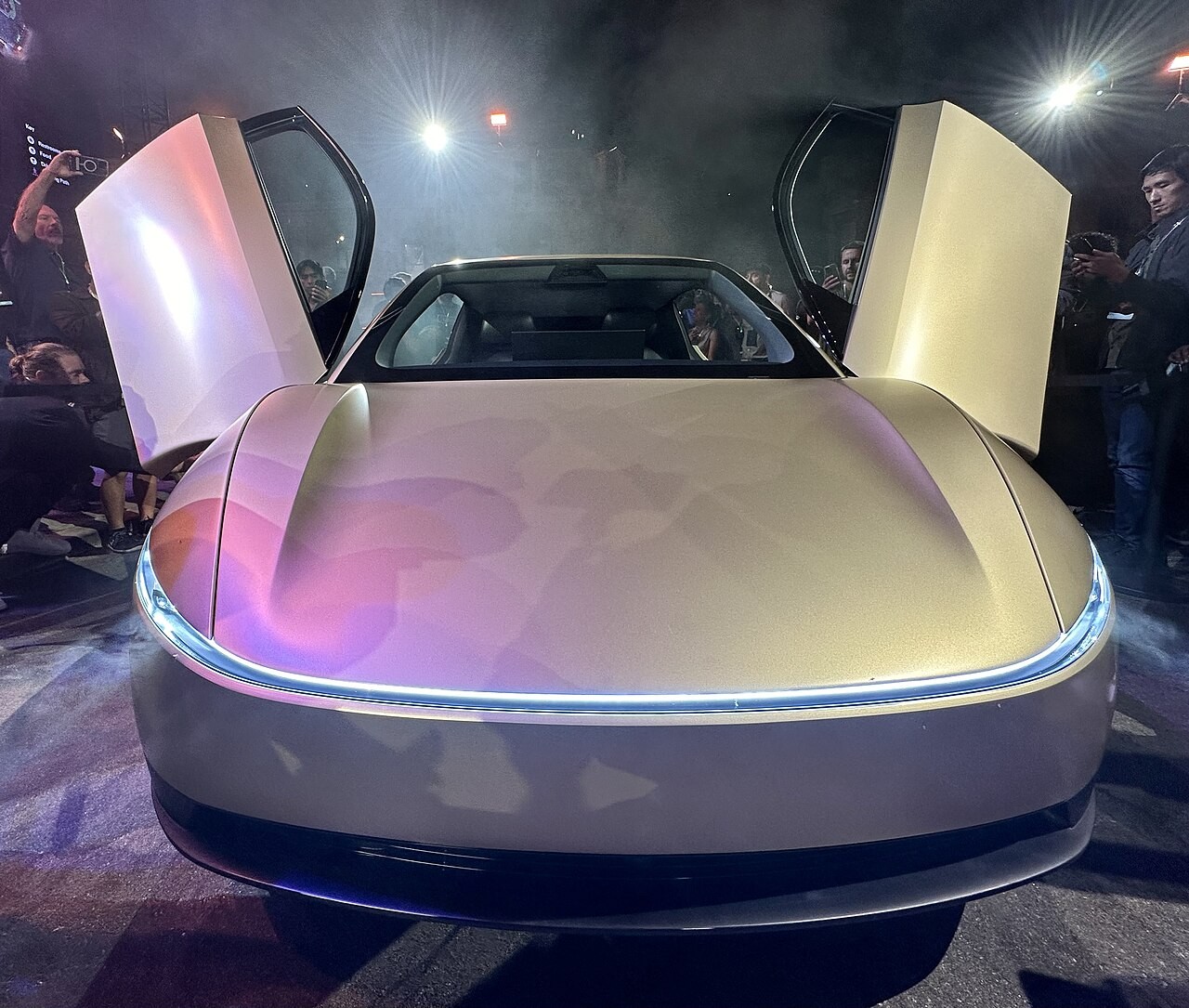 Front view of the Tesla Cybercab showing its full-width light bar