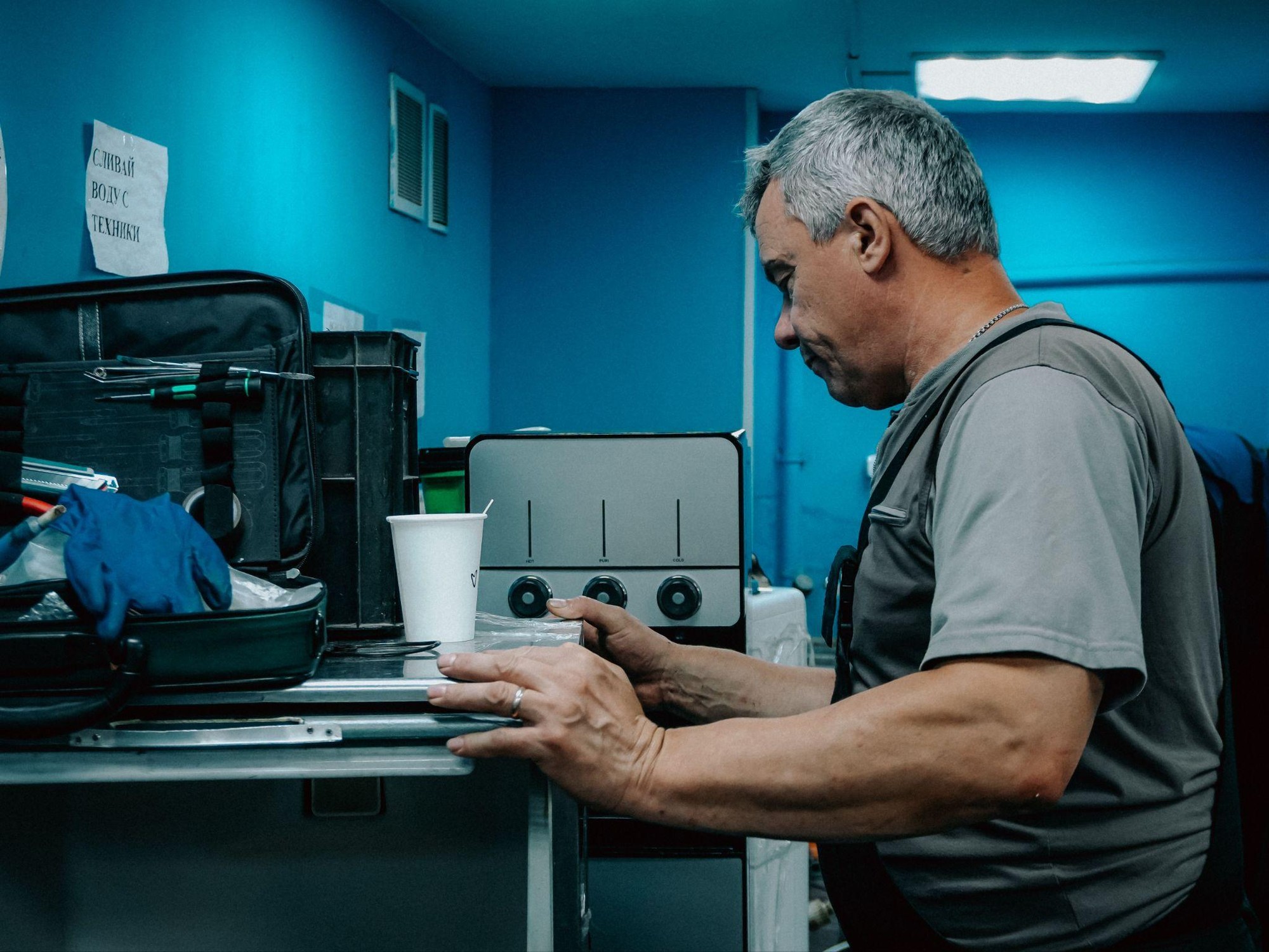 Appliance repair technician working on a home appliance